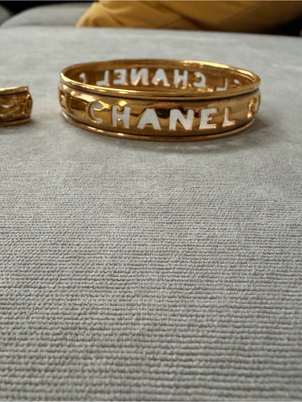 CHANEL Gold Logo Cutout Bracelet with clip on earrings
